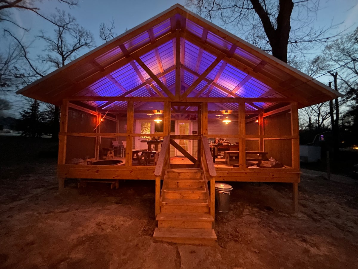 The front porch lit up at dusk