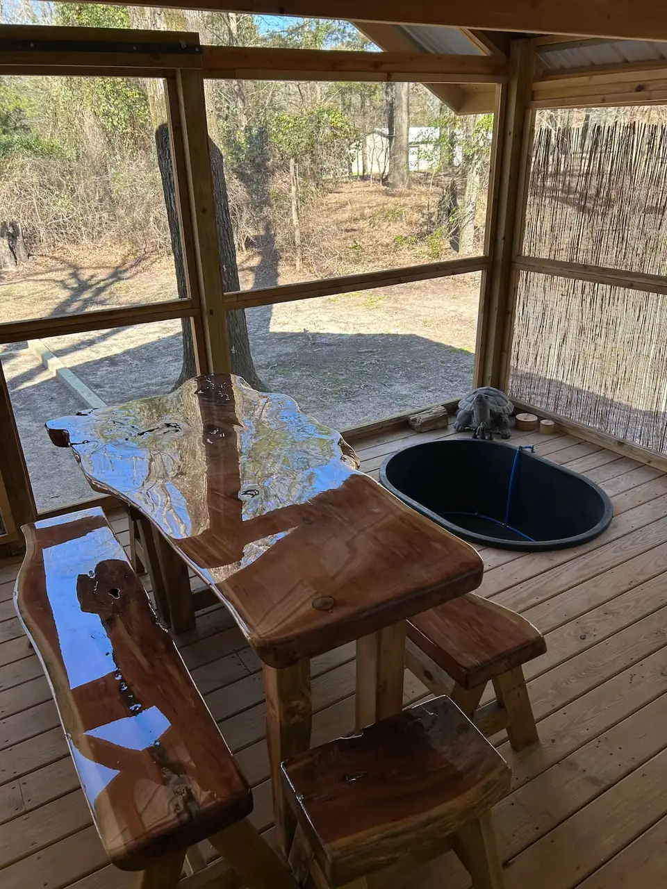 The hot tub and dining table on the porch